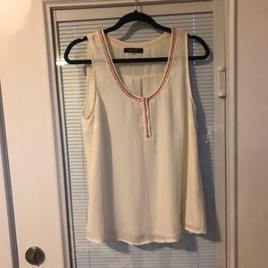 Cream sleeveless blouse